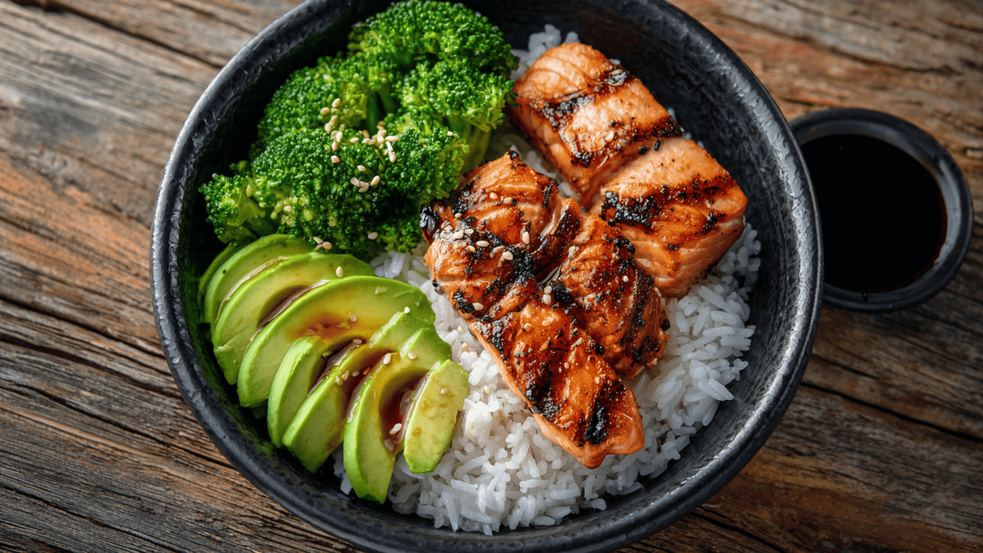 salmon rice bowl with avocado and steamed veggies